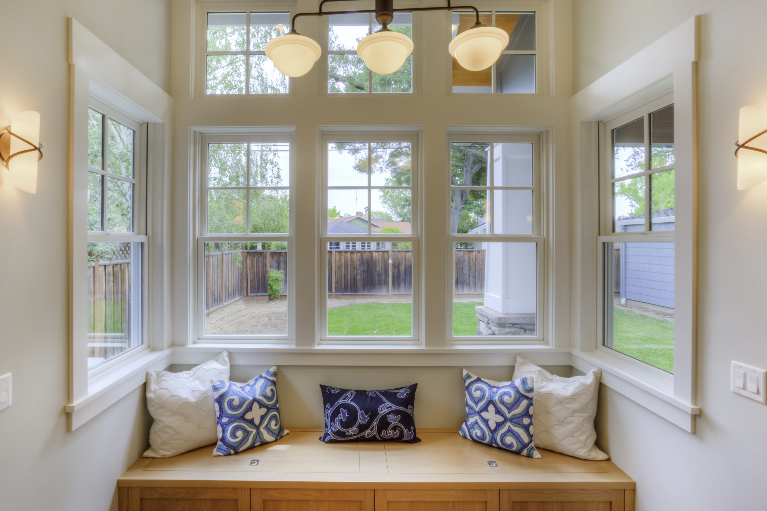 Remodel your living room space by adding custom glass and translucent shades to let in light and keep your privacy