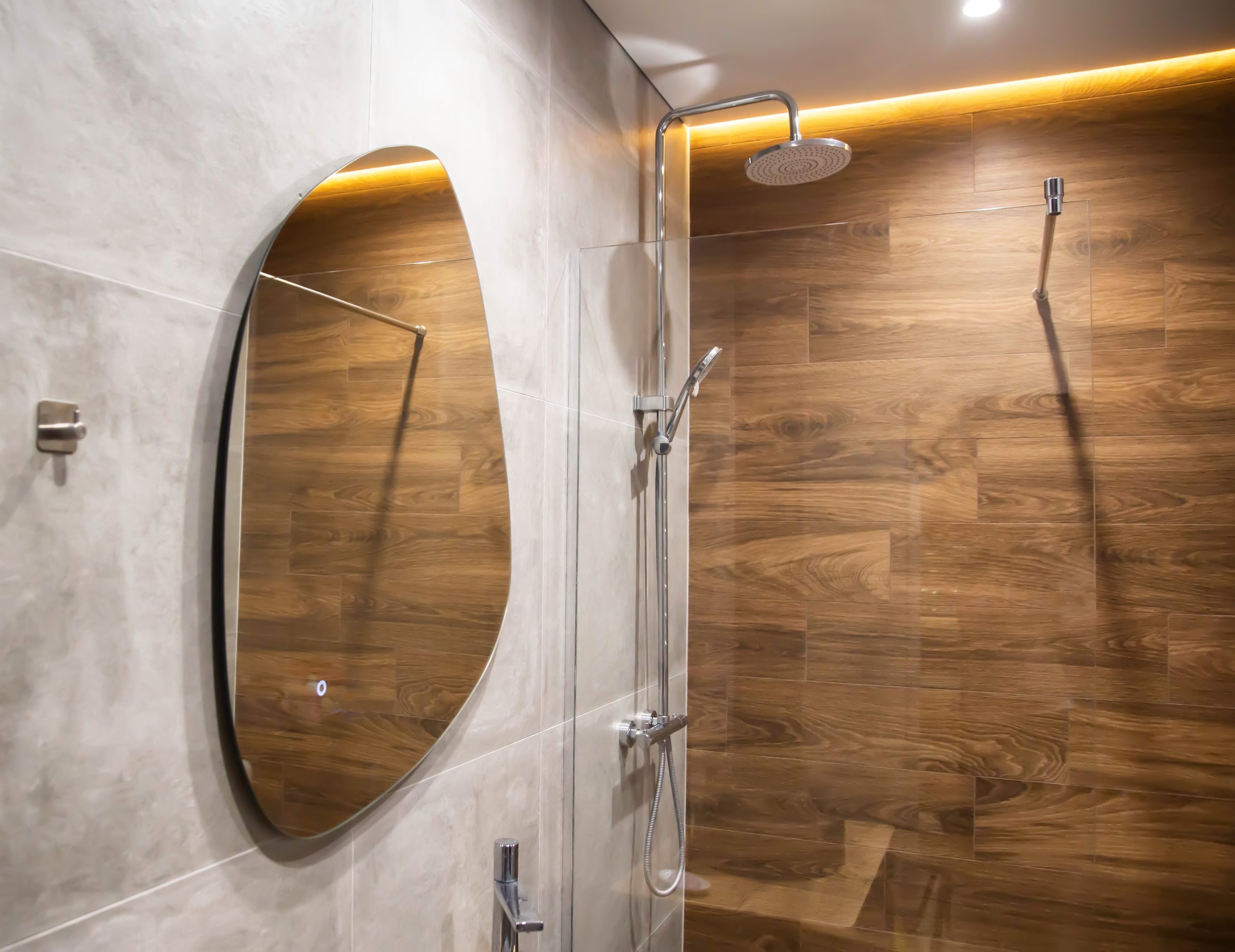 custom shaped mirror in bathroom