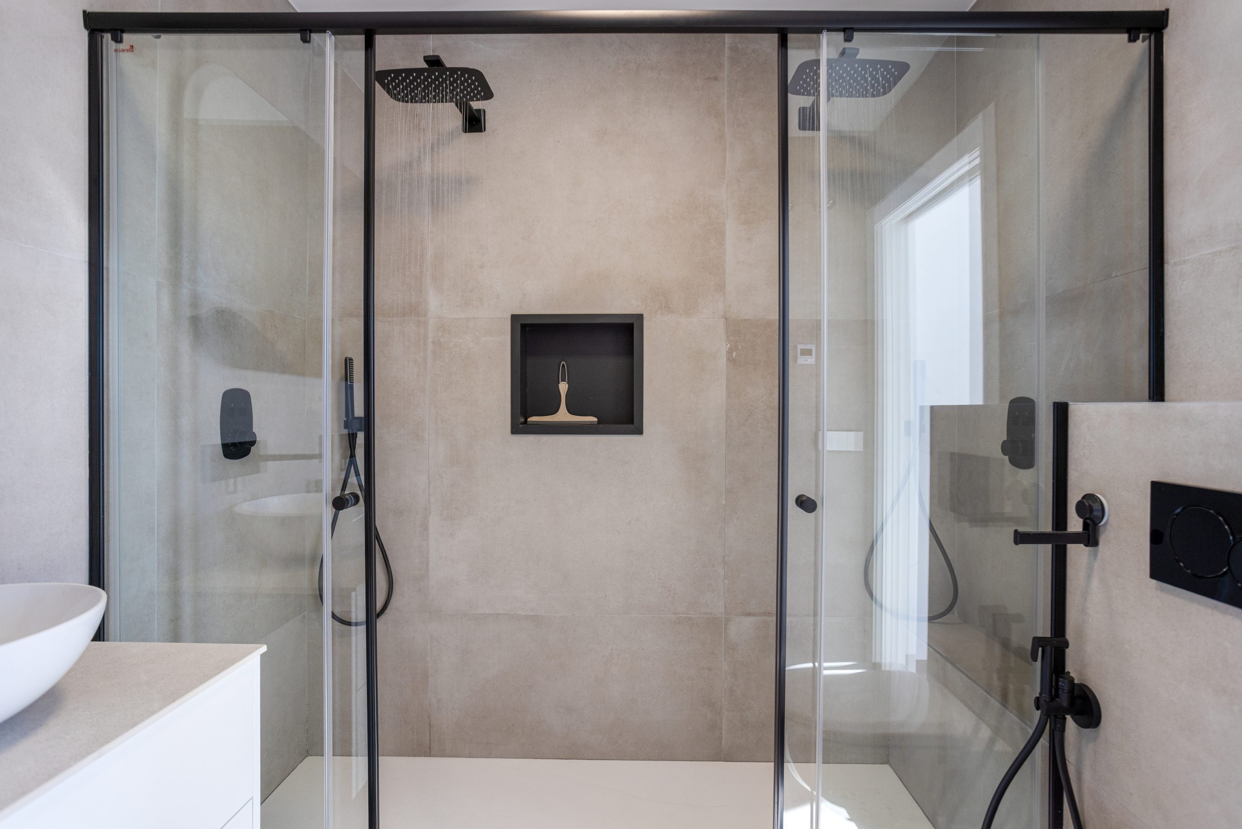 glass shower enclosure in bathroom